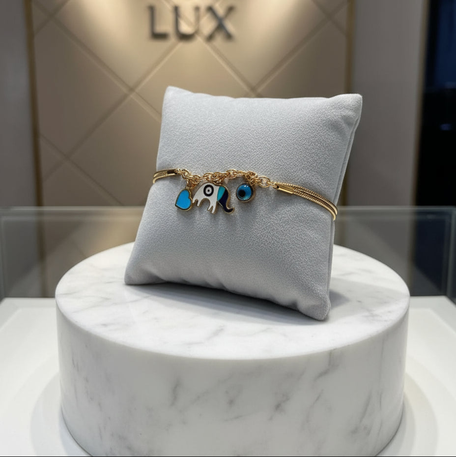 Gold bracelet with elephant and heart charms 