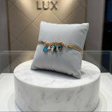 Gold bracelet with elephant and heart charms 