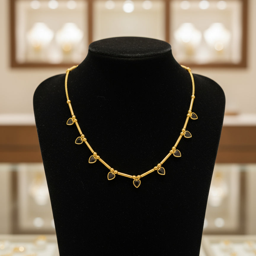 Gold bracelet with heart-shaped charms