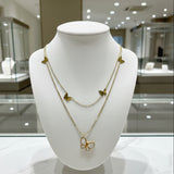 Gold butterfly necklace in a store