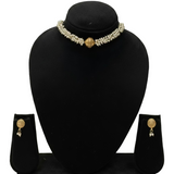 Pearl necklace and earrings set on a green mannequin bust with a plain background