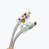 Transparent cable with colorful gemstones on a gray surface