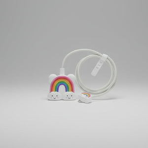White cable with rainbow and cloud designs holding a adult women 