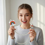 White cable with rainbow and cloud designs holding a adult women 